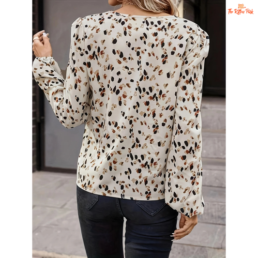 Printed V-neck blouse with full-length sleeves and regular fit, ideal for spring and summer casual elegance.