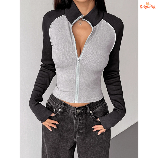 A light gray women’s autumn patchwork sports coat with turtleneck collar, full zipper, long sleeves, and thick knit streetwear design.