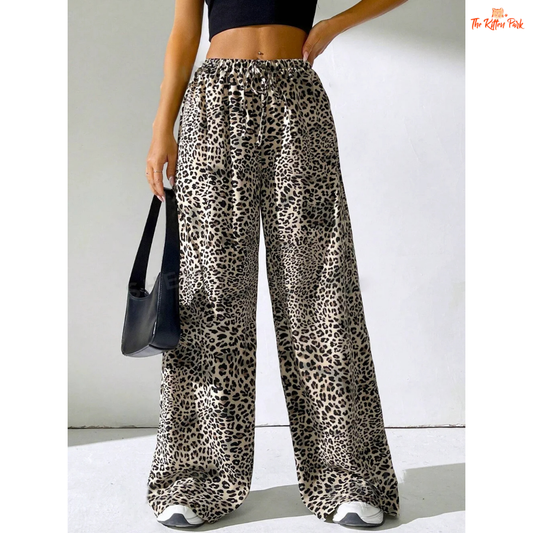 Women's full-length leopard print trousers with lace-up waist and pockets, featuring a straight-leg fit and casual elegance.