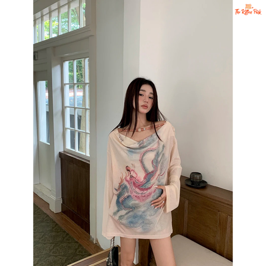 Long beige knit tee for women featuring a cowl neckline, hand-painted print, beaded accents, and a loose fit for stylish autumn layering.