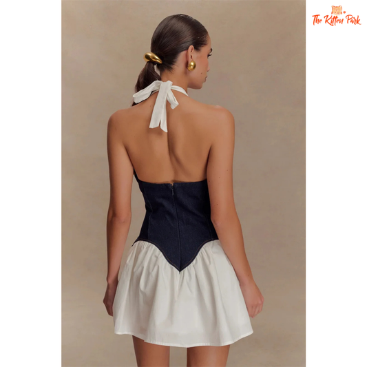 Women's patchwork denim mini dress with deep V halter neckline, sleeveless backless design, and A-line silhouette — made from polyester and spandex.