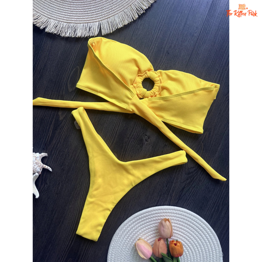 2025 bandeau bikini set for women featuring a wire-free padded top and Brazilian thong bottom, ideal for stylish beach days.