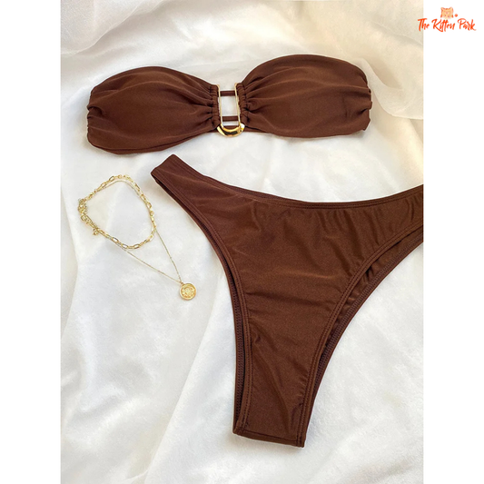 Shiny halter bikini set with underwire push-up top and low-waist thong bottom, made from stretchy polyester and spandex blend.