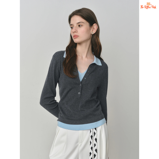 A women’s autumn vintage knit sweater with a cozy fake two-piece design, featuring color block detail, V-neck, and button accents in grey and navy tones.