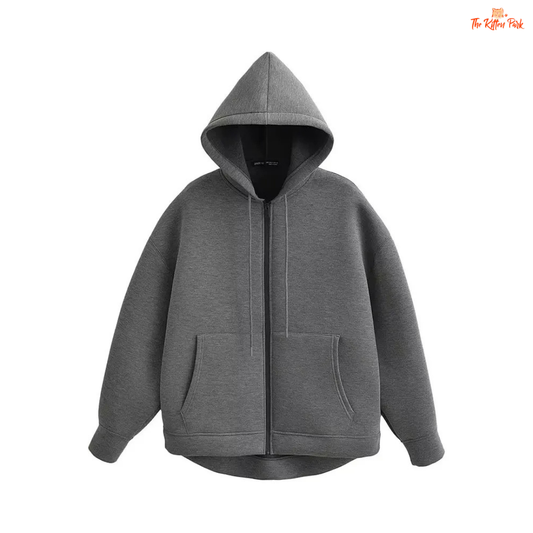 A gray hooded zipper jacket for women with soft polyester fabric, regular fit, full sleeves, pockets, and a casual office-ready design.