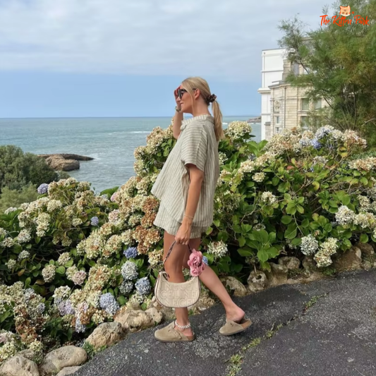 Casual striped two-piece summer set with a loose shirt and high-waist shorts in light khaki.
