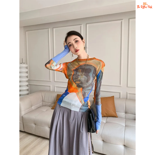 Y2K-style abstract patchwork mesh top with long sleeves and slim fit, combining soft blue and orange tones for a bold streetwear statement.