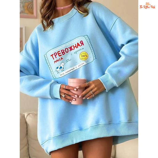 A women’s oversized cotton-polyester sweatshirt with round neck, drop-shoulder sleeves, pullover style, and printed design for autumn/winter wear.