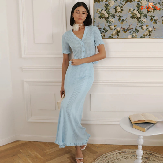 Two-piece hollow knit skirt set for women featuring a V-neck button top and slim-fit ankle-length skirt in cotton-polyester blend for spring and summer.