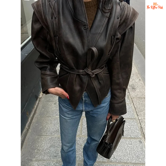 Light brown faux leather overcoat for women with belted high waist, turn-down collar, full sleeves and zipper closure — vintage high-street style for autumn/winter.