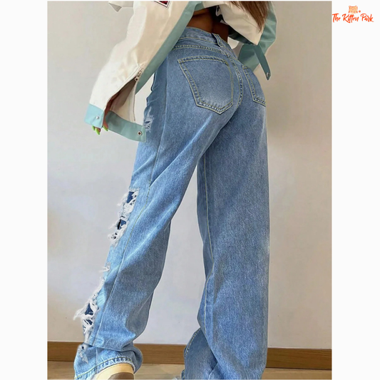 Women's light-wash straight-leg jeans with ripped details, mid-rise waist, soft fabric, and zip fly — perfect for casual street style.