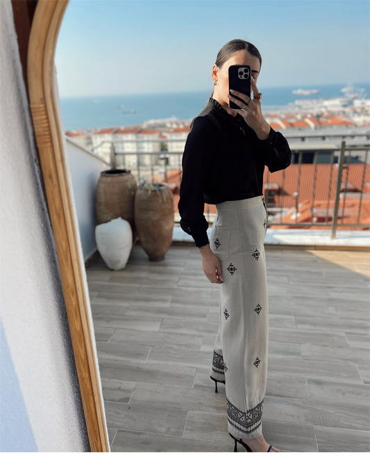 High-waisted embroidered wide-leg pants in breathable cotton-linen fabric, perfect for casual summer looks.