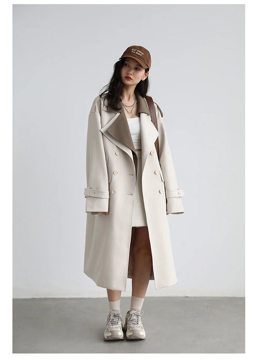 Women’s long double-breasted trench coat with wide waist design, tiered details, and turn-down collar in solid woven fabric