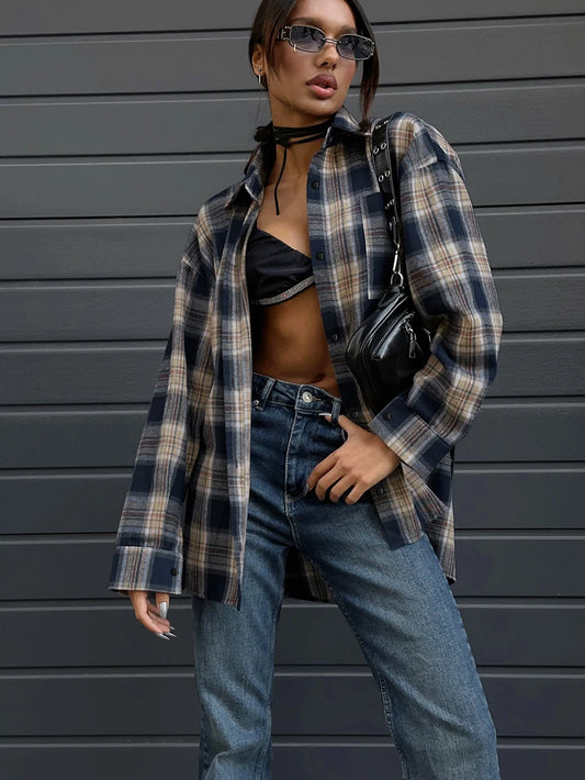 Oversized plaid button-up shirt in navy tones, styled for a relaxed and trendy streetwear look.