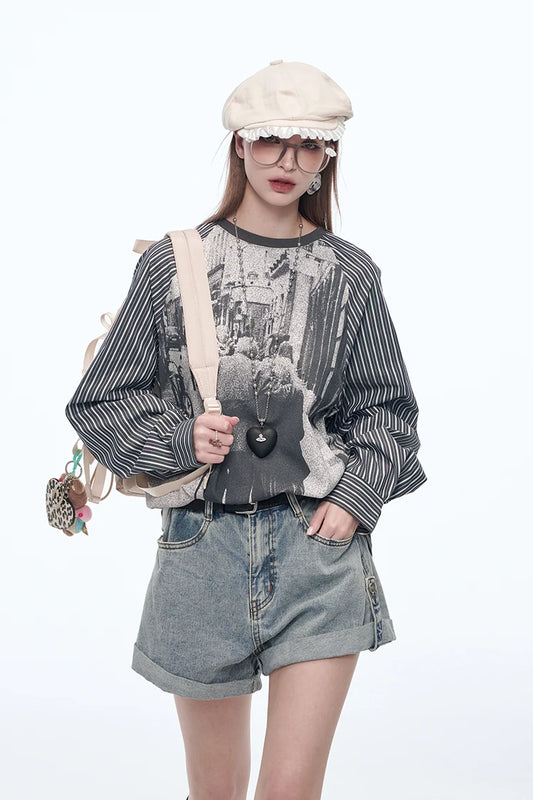 Trendy striped patchwork blouse with cartoon prints and long sleeves, styled for casual streetwear with a soft cotton-spandex blend