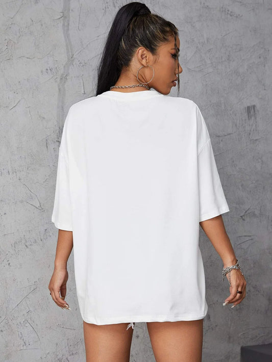 White cotton t-shirt with character print and relaxed fit, ideal for summer streetwear or casual outfits.