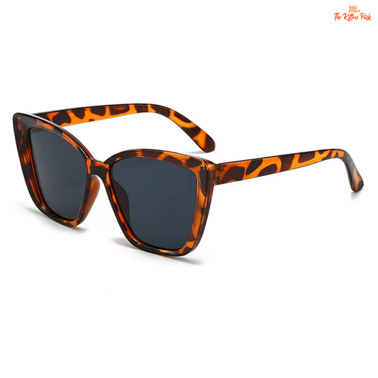 Women's retro cat-eye sunglasses with bold square lenses, UV400 polycarbonate protection, and a lightweight plastic frame for vintage outdoor style.
