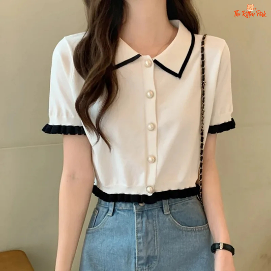 Retro Korean slim-fit crop blouse for women featuring a turn-down collar, short sleeves, and soft knit texture in a solid color.