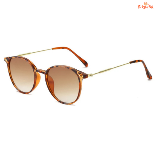 Vintage round sunglasses with alloy frame and UV-protective lenses, designed for women seeking a retro luxury accessory for everyday travel and style.