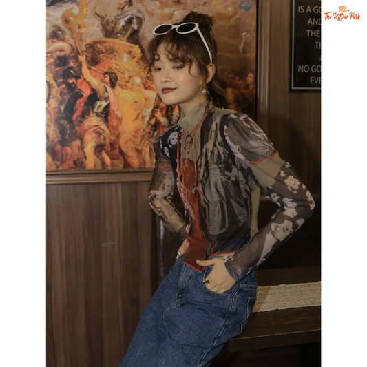 Beige asymmetrical mesh blouse for women with patchwork character print, puff sleeves, turtleneck collar, and slim vintage fit.