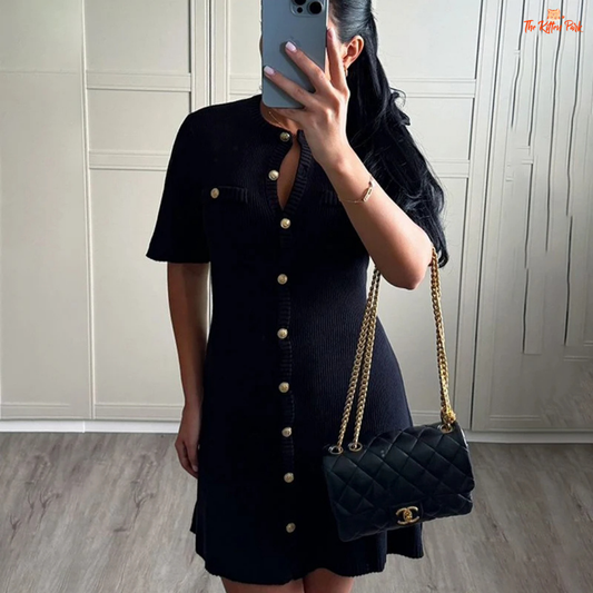 Black ribbed knit mini dress with metal buttons, slim fit design, and soft texture, ideal for autumn casual elegance.