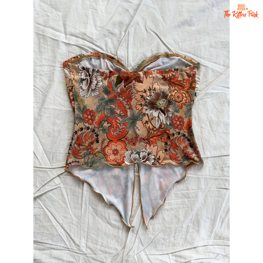 Women's Euro-style holiday blouse featuring a strapless asymmetric design with floral print — ideal for summer beachwear and vacation looks.