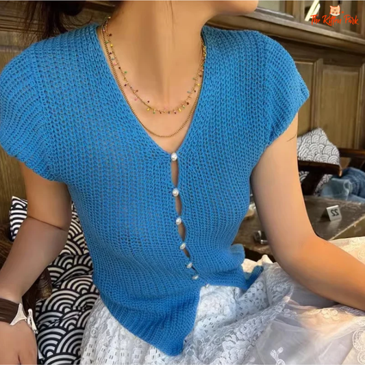 Slim-fit V-neck knit crop cardigan with front button closure, made from stretchy polyester-spandex blend. Ideal for light layering in spring and summer.