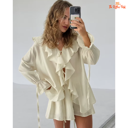Women's apricot ruffled tie top and shorts set – lightweight two-piece with V-neck, pleats, and hollow-out accents for summer elegance.