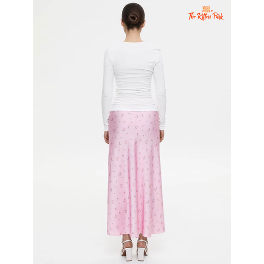 Y2K-style patchwork maxi skirt for women, ankle-length with slim fit and high waist design, featuring floral elements and blended fabric.