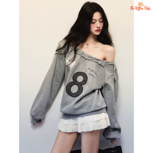 Women's gray off-shoulder sweatshirt with bold letter print and loose Y2K streetwear design, made of cotton and polyester blend.