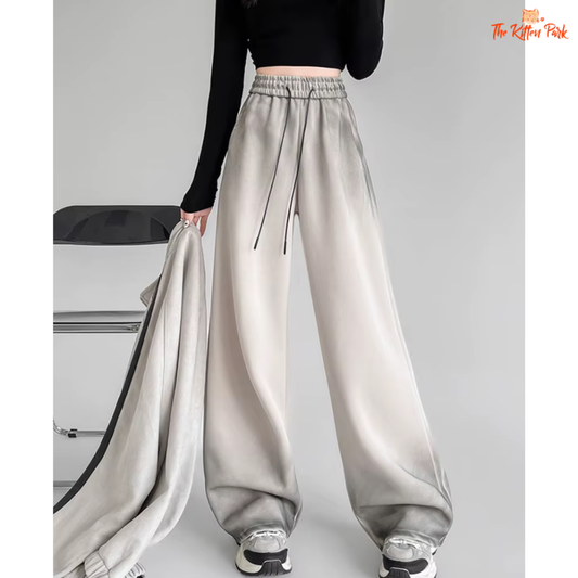 Women's Y2K tie-dye sweatpants with high waist, wide leg fit, and lace-up front — retro streetwear style made from cotton-polyester blend.