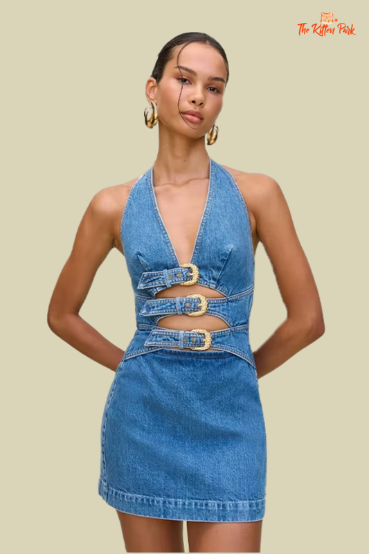 Backless denim mini dress with halter neck, empire waist, zip-up closure, and metal buckle – trendy sheath silhouette for Summer 2025.