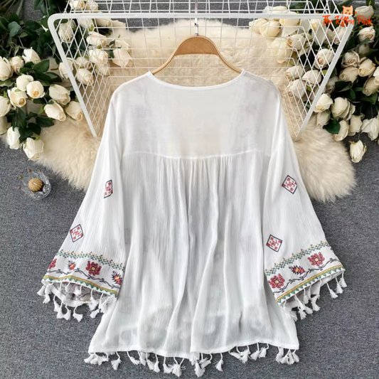 Boho-style chiffon cardigan with embroidery and tassel waist, perfect for layering in spring and summer.