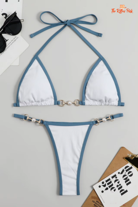 Sexy 2025 micro bikini set with chain details, high-waisted thong bottom in cream and blue tones, Brazilian style swimwear.