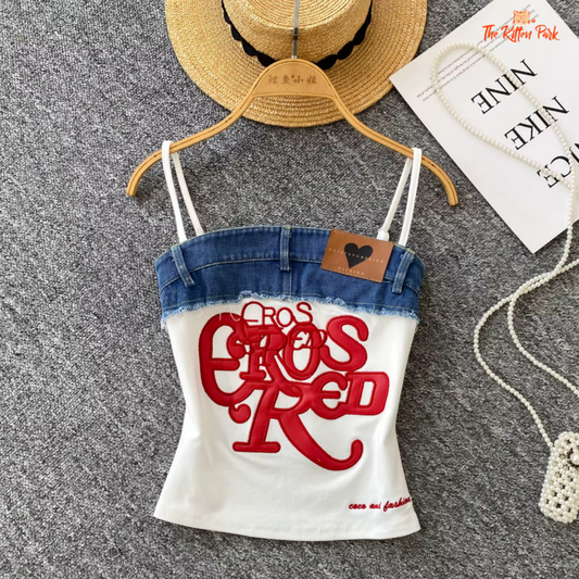 Y2K denim crop top with patchwork and embroidery, featuring feathers and streetwear flair.