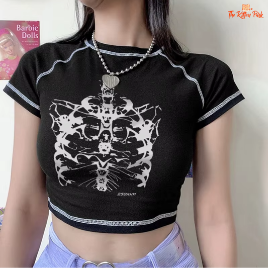 Y2K skull print crop top with long sleeves, slim fit design, and bold graphic for edgy streetwear style.