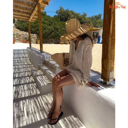 Boho-style hollow out knit mini dress in khaki, perfect as a beach cover-up for summer holidays.