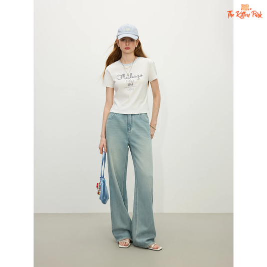 Sporty Y2K-style crop jersey tee with racerback cut, letter print, and casual fit in cotton-spandex fabric, ideal for gym or streetwear looks.