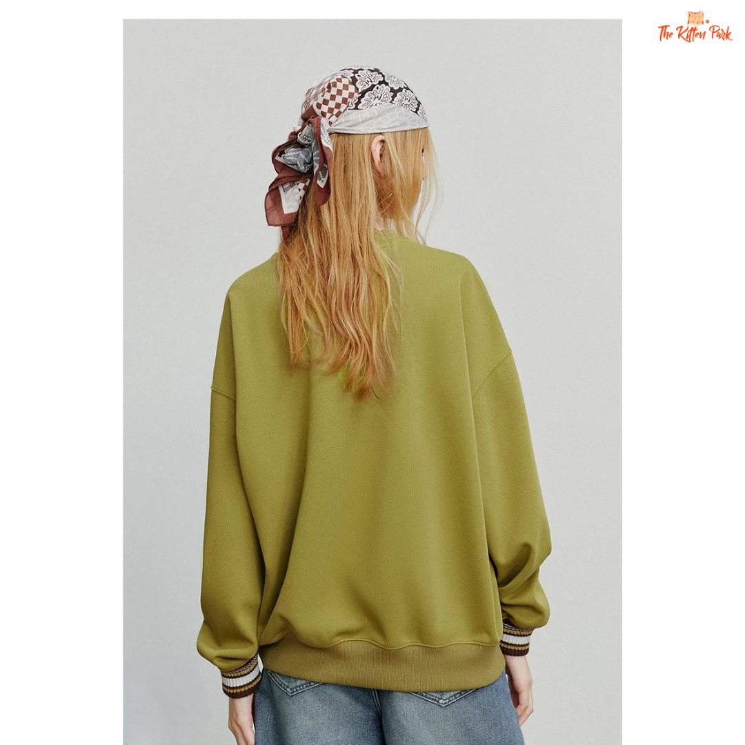 2026 Women's Cat Embroidery Striped Sleeve Cotton Pullover with cute cat embroidery, striped sleeves, and loose casual autumn style.