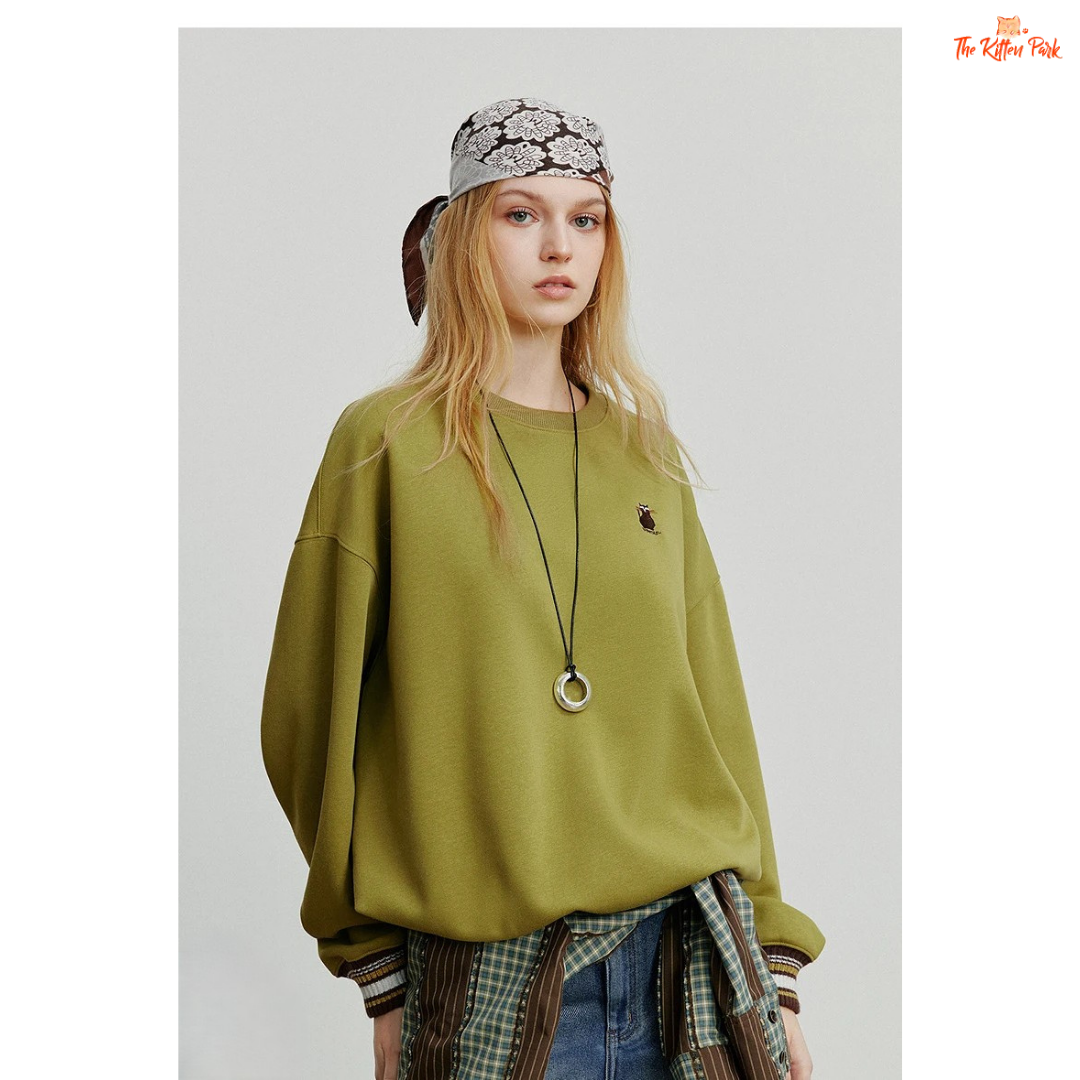 2026 Women's Cat Embroidery Striped Sleeve Cotton Pullover with cute cat embroidery, striped sleeves, and loose casual autumn style.