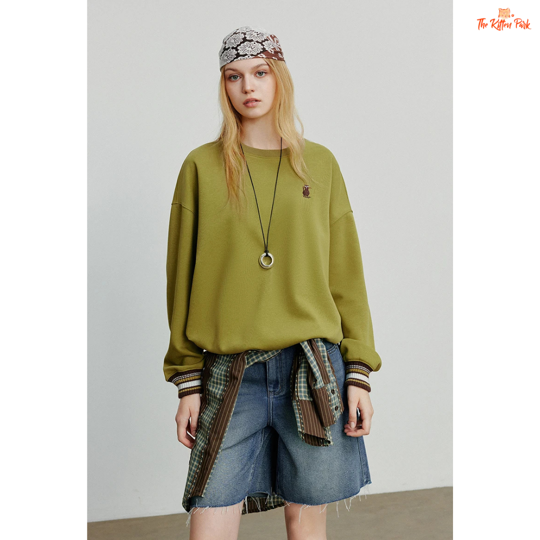 2026 Women's Cat Embroidery Striped Sleeve Cotton Pullover with cute cat embroidery, striped sleeves, and loose casual autumn style.