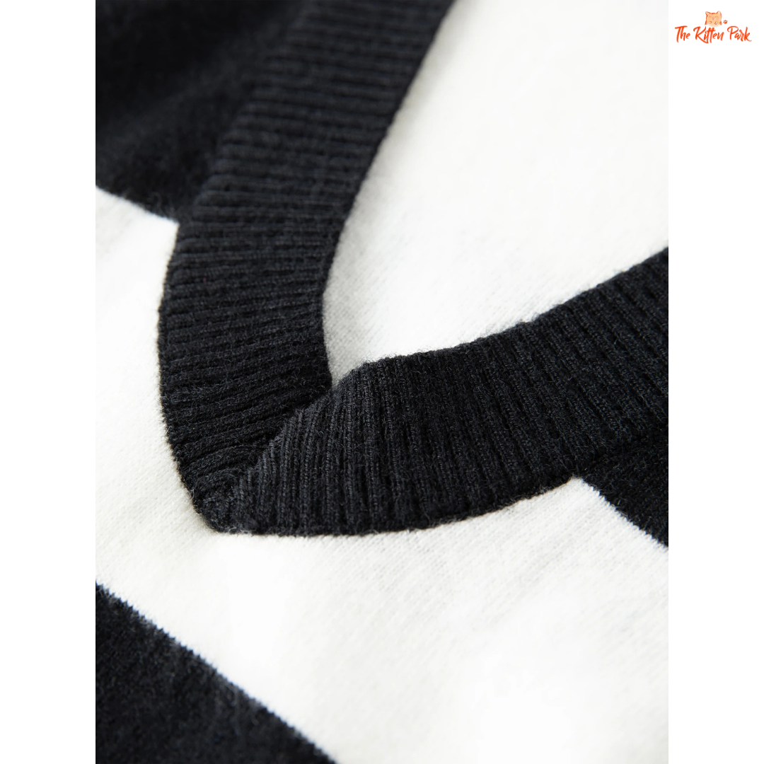 2026 Women's V-neck Striped Fake Two-Piece Wool Sweater with layered look, striped knit pattern, and casual autumn/winter style.