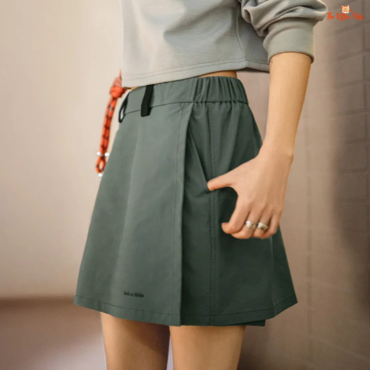 Lightweight outdoor A-line skort for women with elastic waist and pockets, designed for summer hiking comfort in a casual above-knee silhouette.