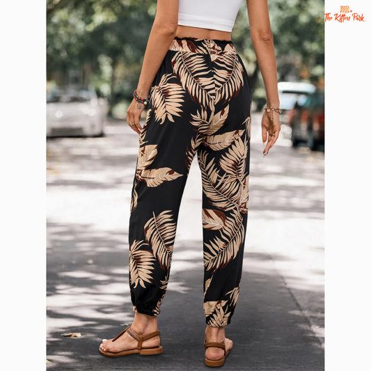 Women's casual jogger pants with floral plant print, side pockets, and relaxed fit — ideal for summer comfort and casual streetwear.