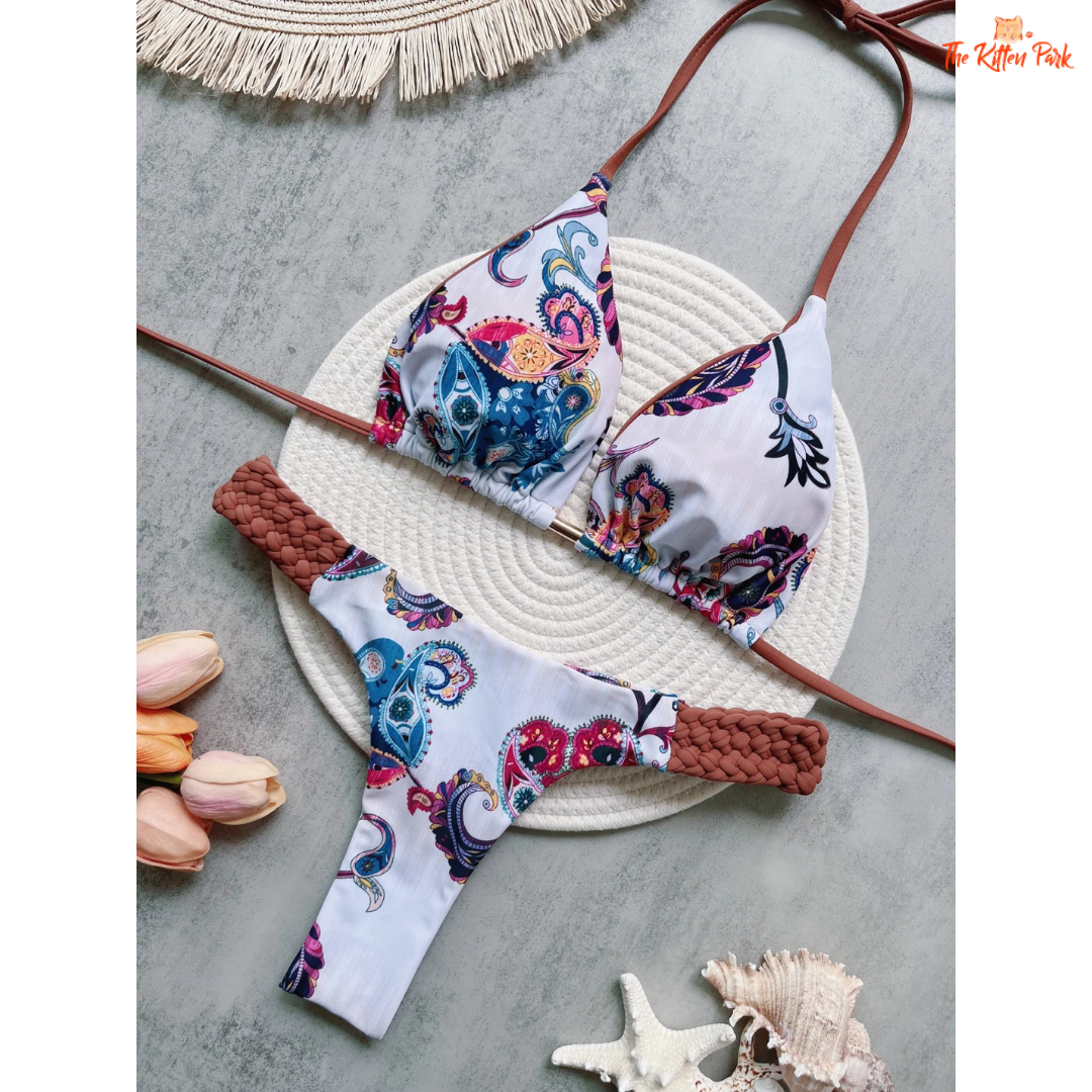 Printed halter bikini set for women featuring a high-cut mini thong design and wire-free top, perfect for summer beachwear.