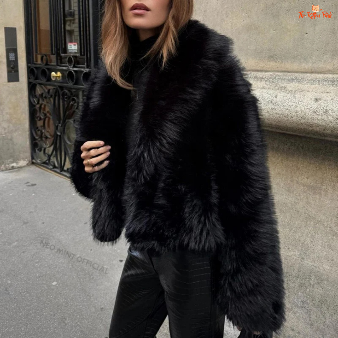 A black faux fox fur coat for women with a shawl collar, batwing sleeves, and short streetwear cut for warm and stylish winter fashion.