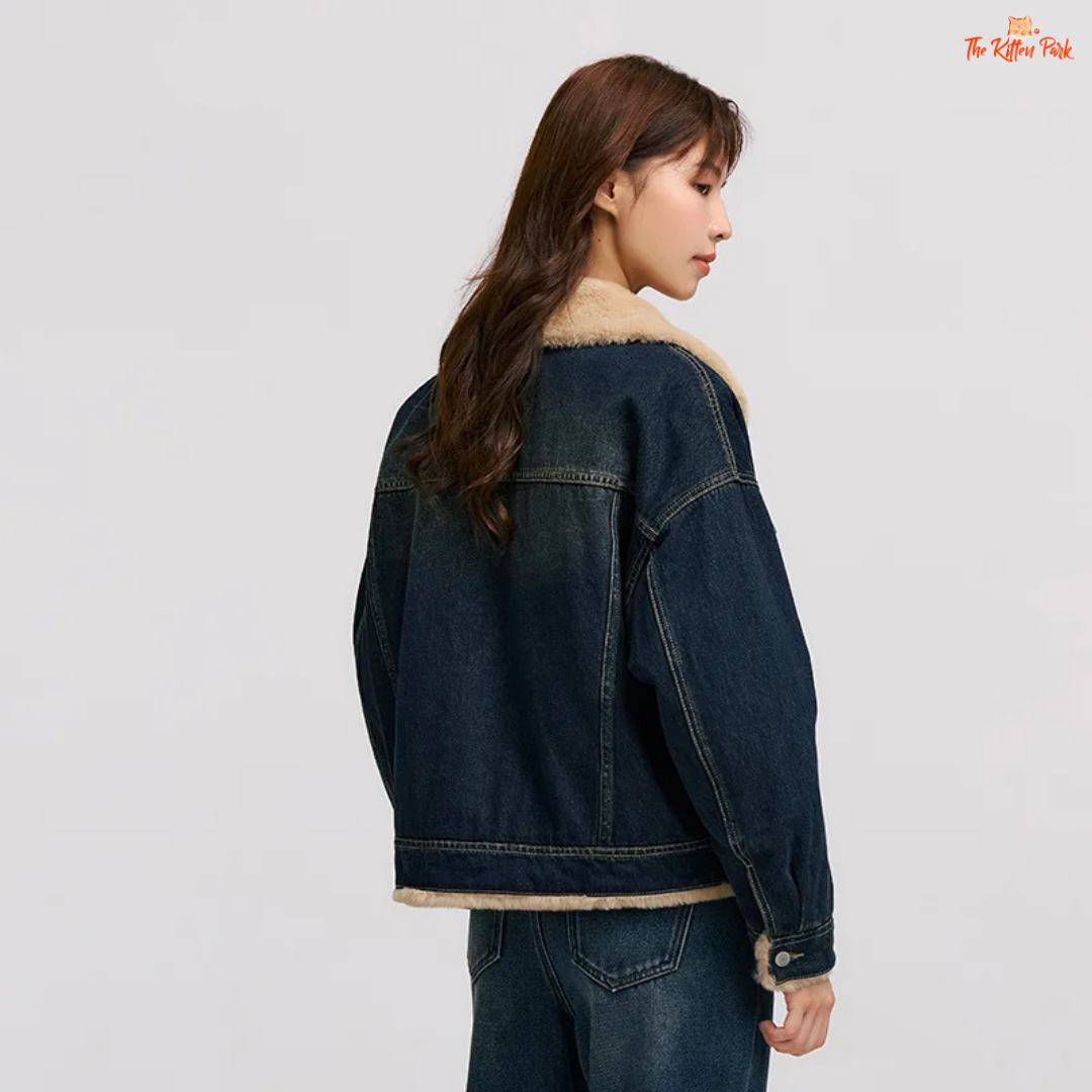 A women’s patchwork denim jacket with quilted design, faux fur lapel, and single-breasted closure for cozy winter wear.