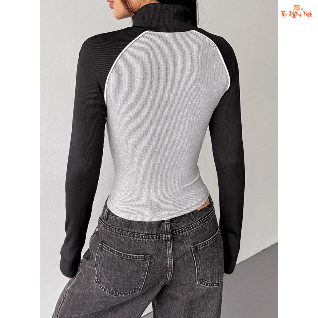 A light gray women’s autumn patchwork sports coat with turtleneck collar, full zipper, long sleeves, and thick knit streetwear design.