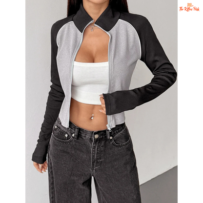 A light gray women’s autumn patchwork sports coat with turtleneck collar, full zipper, long sleeves, and thick knit streetwear design.