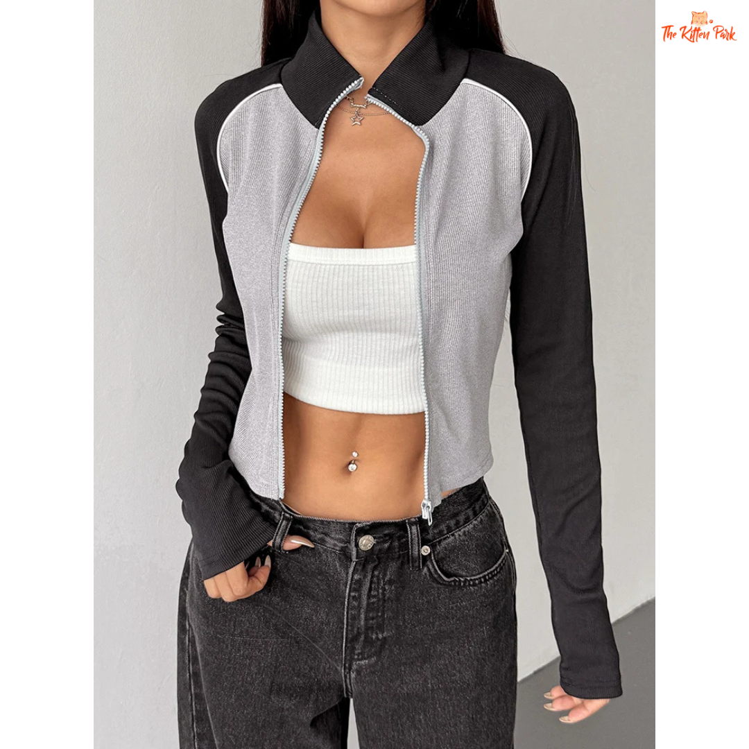 A light gray women’s autumn patchwork sports coat with turtleneck collar, full zipper, long sleeves, and thick knit streetwear design.